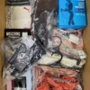 The photo shows a package with clothing in the category AU.