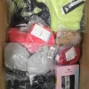 The photo shows a package with clothing in the category AU.