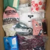 The photo shows a package with clothing in the category AU.