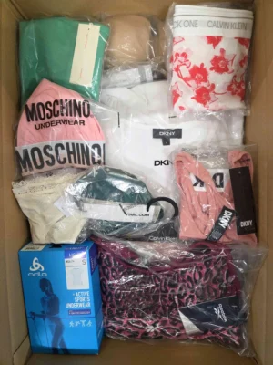 The photo shows a package with clothing in the category AU.