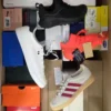 The photo shows a package with footwear in the category BS.