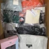 The photo shows a package with clothing in the category AU.
