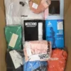The photo shows a package with clothing in the category AU.