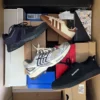 The photo shows a package with footwear in the category BS.