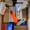The photo shows a package with footwear in the category BS.