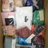 The photo shows a package with clothing in the category AU.