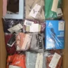 The photo shows a package with clothing in the category AU.