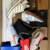 The photo shows a package with footwear in the category BS.