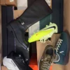 The photo shows a package with footwear in the category BS.