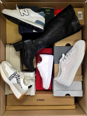 The photo shows a package with footwear in the category BS.