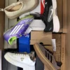 The photo shows a package with footwear in the category BS.