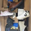 The photo shows a package with footwear in the category BS.