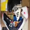 The photo shows a package with footwear in the category BS.