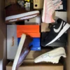 The photo shows a package with footwear in the category BS.