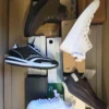 The photo shows a package with footwear in the category BS.