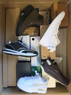 The photo shows a package with footwear in the category BS.