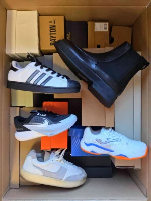 The photo shows a package with footwear in the category BS.