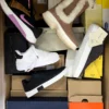 The photo shows a package with footwear in the category BS.