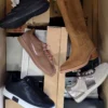 The photo shows a package with footwear in the category BS.