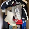 The photo shows a package with footwear in the category BS.