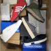 The photo shows a package with footwear in the category BS.