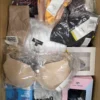 The photo shows a package with clothing in the category AU.