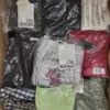 The photo shows a package with clothing in the category AW.
