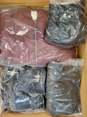 The photo shows a package with clothing in the category AJS.