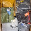 The photo shows a package with clothing in the category AJS.