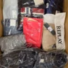 The photo shows a package with clothing in the category AM.
