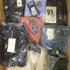 The photo shows a package with clothing in the category AM.