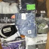 The photo shows a package with clothing in the category AM.
