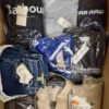 The photo shows a package with clothing in the category AM.