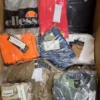 The photo shows a package with clothing in the category AM.
