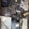 The photo shows a package with clothing in the category AM.
