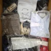 The photo shows a package with clothing in the category AM.
