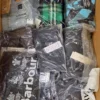 The photo shows a package with clothing in the category AM.