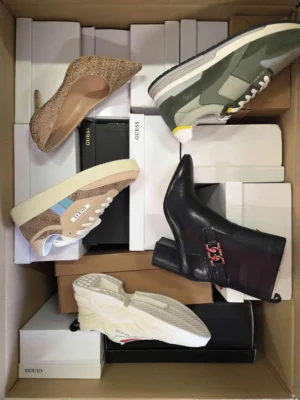 The photo shows a package with footwear in the category BS.