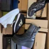 The photo shows a package with footwear in the category CS.
