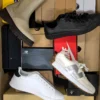 The photo shows a package with footwear in the category CS.