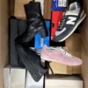 The photo shows a package with footwear in the category CS.