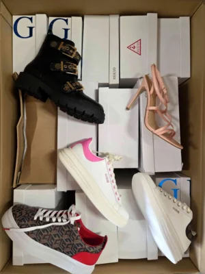 The photo shows a package with footwear in the category BS.