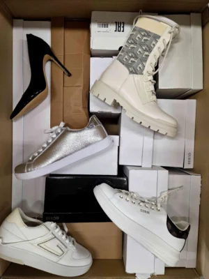 The photo shows a package with footwear in the category BS.