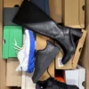 The photo shows a package with footwear in the category CS.