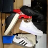 The photo shows a package with footwear in the category CS.