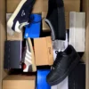 The photo shows a package with footwear in the category CS.