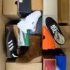 The photo shows a package with footwear in the category CS.