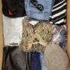 The photo shows a package with clothing in the category TSC.