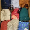 The photo shows a package with clothing in the category TSC.