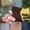 The photo shows a package with clothing in the category TSC.
